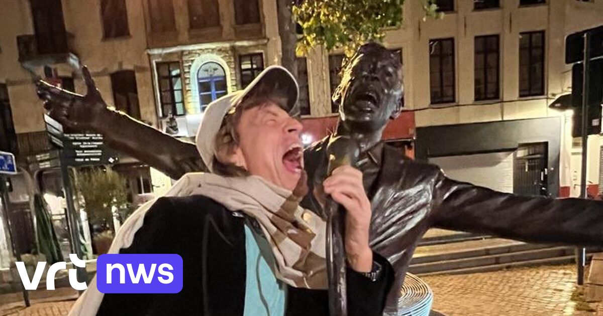 Mick Jagger drinks cocktail in Brussels and poses near statue of Jacques Brel