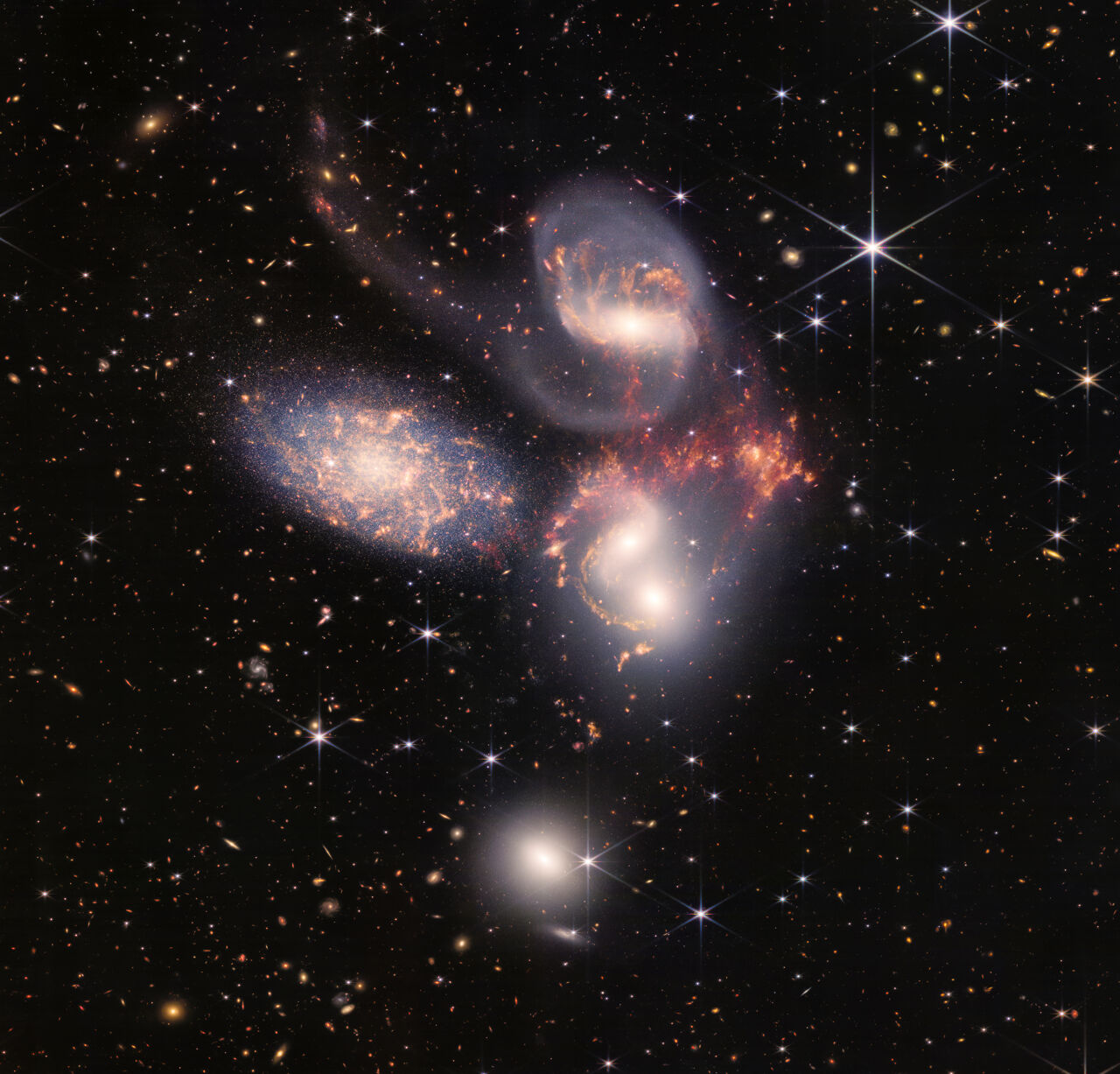 Stephan's Quintet, a collection of galaxies that will slowly but surely merge. Stephan's Quintet, a collection of galaxies that will slowly but surely merge.