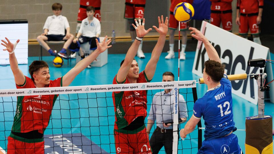 Maaseik's Ferre Reggers, Maaseik's Veeti Nikkinen and Roeselare's Seppe Rotty fight for the ball during a volleyball match between Knack Roeselare and Greenyard Maaseik, Thursday 25 April 2024 in Roeselare, the fourth match of the best-of-five finals in the Play Offs of the Belgian volleyball competition. BELGA PHOTO KURT DESPLENTER