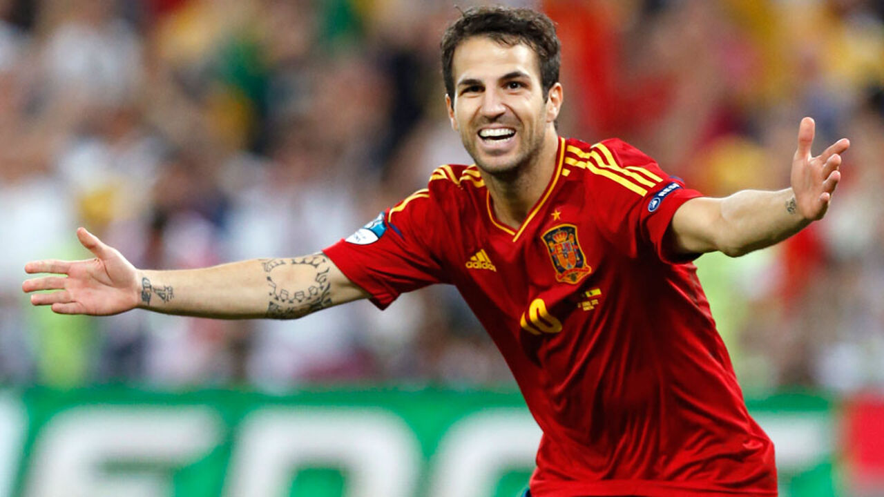  Cesc Fabregas celebrates a goal for the Spain national football team during a match.