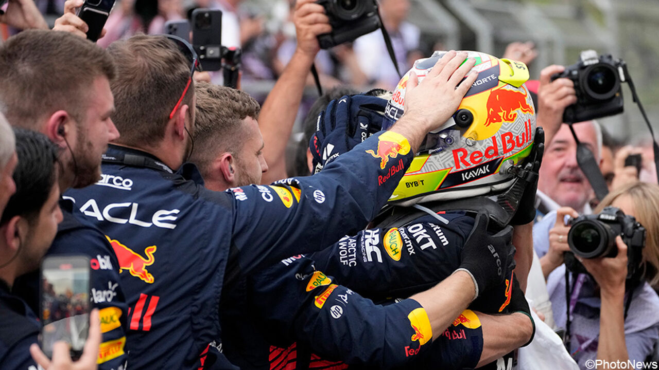 Red Bull employees celebrate with race winner Sergio Perez. Sergio Perez