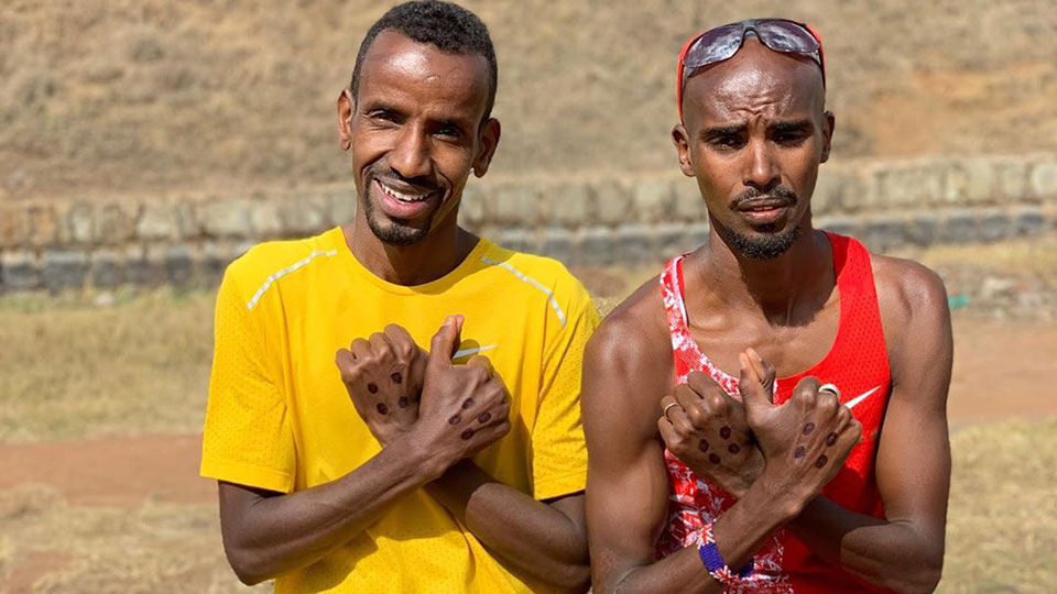 Bashir Abdi (l) en Mo Farah.