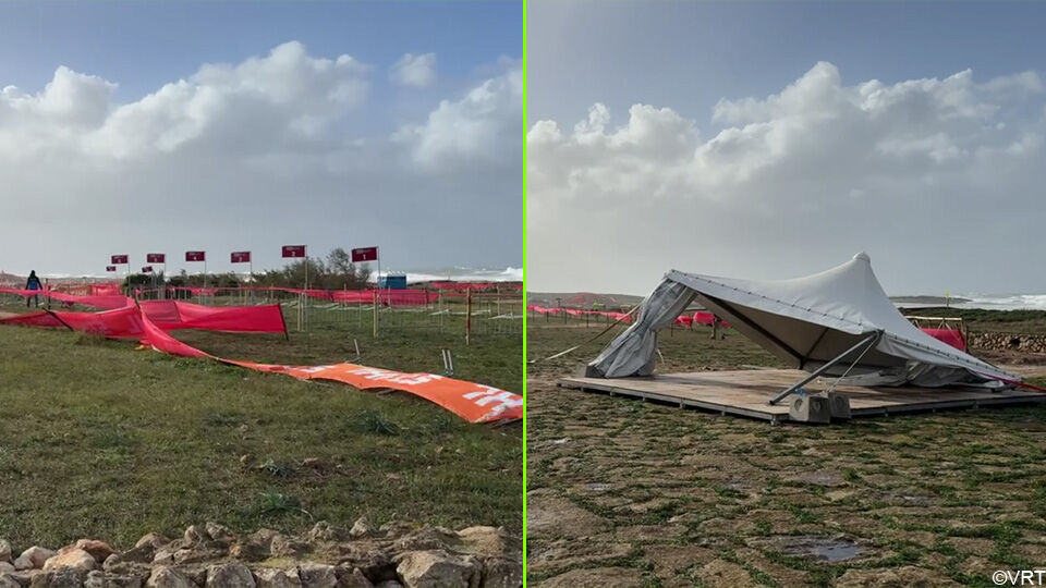 Omheiningen en tenten naast het parcours zijn omver geblazen door de wind.